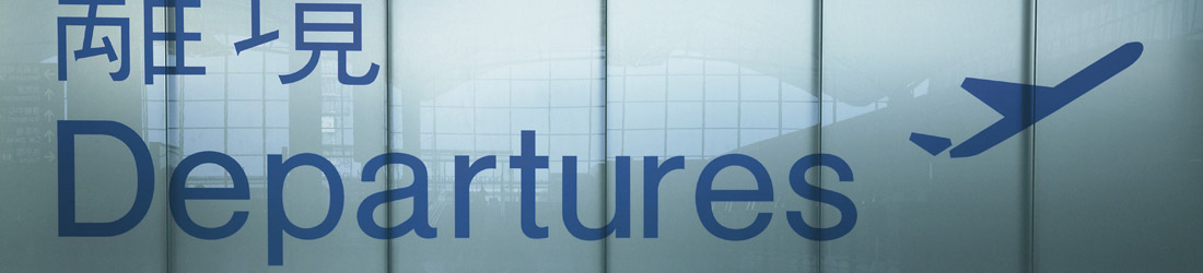 View of Asian departures sign with English translation